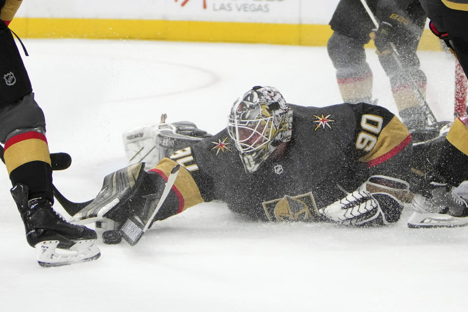 Vegas Golden Knights goaltender Robin Lehner (90) makes a save against the New Jersey Devils during the first period of an NHL hockey game Monday, April 18, 2022, in Las Vegas. (AP Photo/Joe Buglewicz)