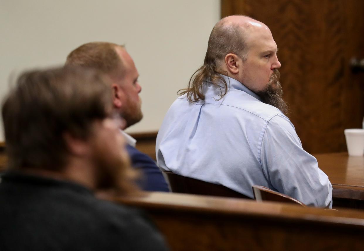 Joshua Scolman listens to opening statements during his trial on Monday at the Brown County Courthouse in Green Bay. Scolman is accused of first-degree homicide in the death of Timothy Nabors, a Black man, and the attempted homicide of a second man, who is also Black. All three men were incarcerated at Green Bay Correctional Institute at the time. Hate crime enhancers have been added to both charges.
