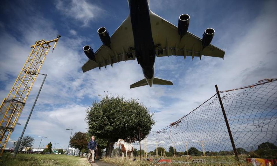 A passenger plane prepares to land at Heathrow, the busiest airport in the UK and the third busiest in the world.