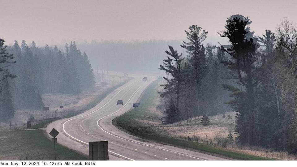 Smoke from Canadian wildfires has been mixing down to the surface, as seen by this @MnDOT webcam near Cook, MN.
