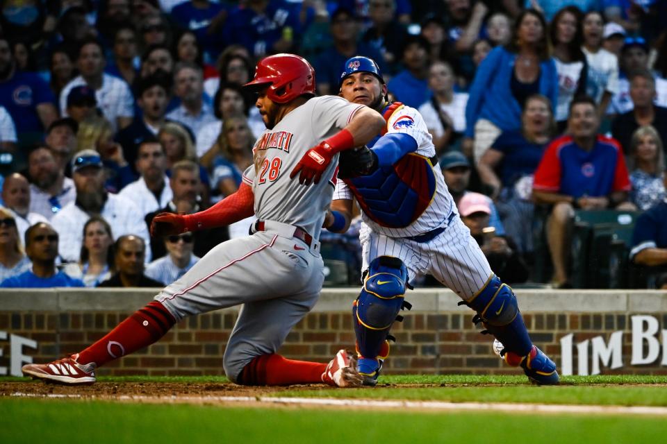 Jun 29, 2022; Chicago, Illinois, USA; Chicago Cubs catcher Willson Contreras (40) tags out Cincinnati Reds left fielder Tommy Pham (28) at home plate during the fourth inning at Wrigley Field.