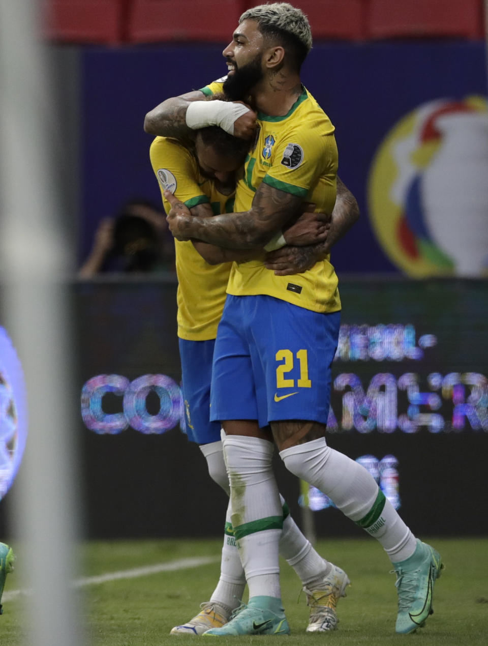 Brazil's Gabriel Barbosa, right, celebrates scoring his side's third goal against Venezuela with teammate Neymar during a Copa America soccer match at the National Stadium in Brasilia, Brazil, Sunday, June 13, 2021. (AP Photo/Eraldo Peres)