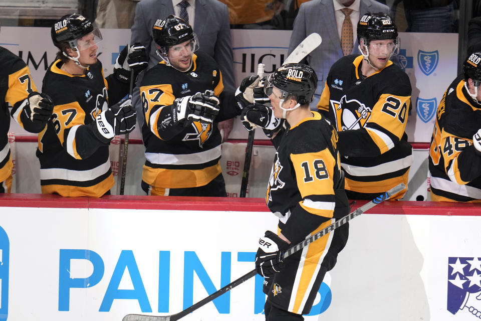 Pittsburgh Penguins' Jesse Puljujarvi (18) returns to the bench after after scoring against the Columbus Blue Jackets during the first period of an NHL hockey game in Pittsburgh, Tuesday, March 5, 2024. (AP Photo/Gene J. Puskar)