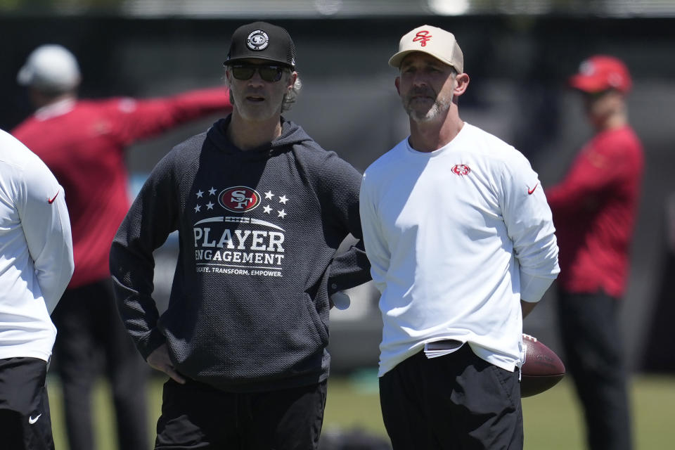 San Francisco 49ers defensive coordinator Nick Sorensen, left, and head coach Kyle Shanahan watch players during the NFL football team's rookie minicamp in Santa Clara, Calif., Friday, May 10, 2024. (AP Photo/Jeff Chiu)