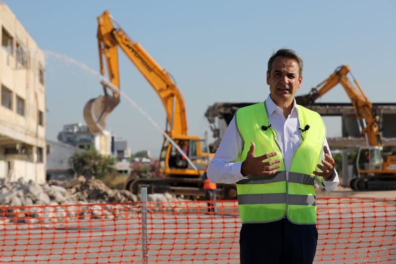Greek Prime Minister Kyriakos Mitsotakis and Lamda Development CEO Odisseas Athanasiou attend an inaugural ceremony of works at the disused Hellenikon airport in Athens