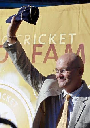 Former New Zealand cricketer Martin Crowe accepts a cap as induction into the ICC Cricket Hall Of Fame at the Cricket World Cup match between Australia and New Zealand in Auckland, in this file picture taken February 28, 2015. REUTERS/Nigel Marple/Files