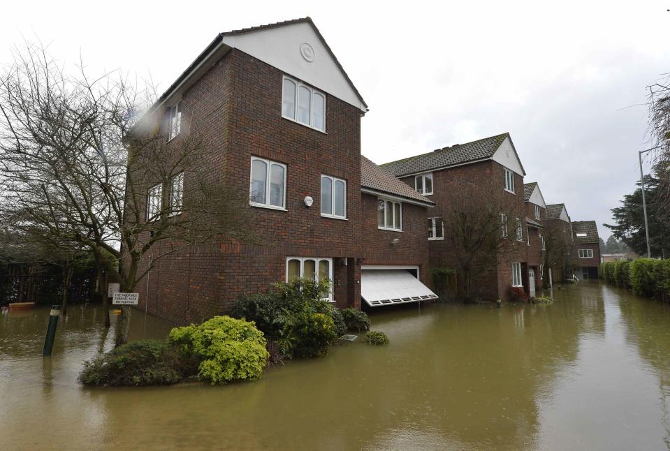 Riverside properties are seen partially submerged in floodwaters from the River Thames, at Old Windsor in southern England