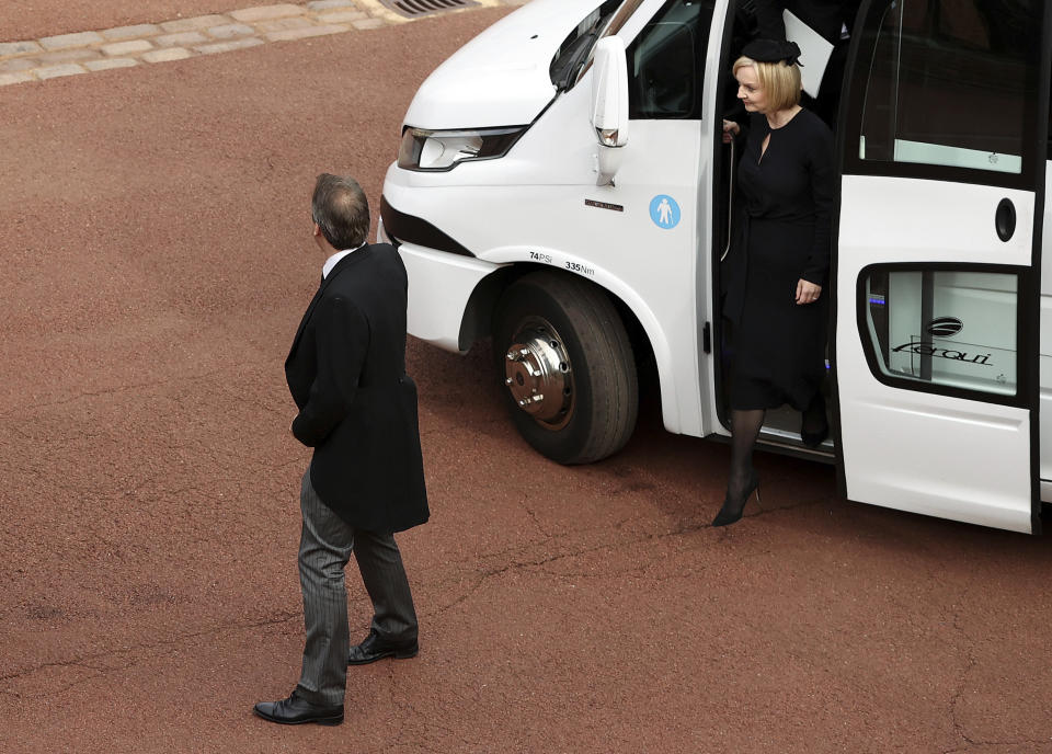 Britain's Prime Minister Liz Truss and her husband Hugh O'Leary arrive at Windsor Castle, Windsor, England, Monday Sept. 19, 2022, ahead of the committal service for Queen Elizabeth II. The Queen, who died aged 96 on Sept. 8, will be buried at Windsor alongside her late husband, Prince Philip, who died last year. (Ryan Pierse/Pool via AP)