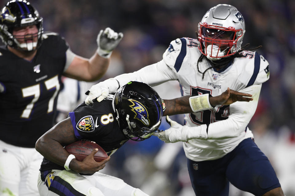 FILE - In this Nov. 3, 2019, file photo, New England Patriots outside linebacker Dont'a Hightower (54) tackles Baltimore Ravens quarterback Lamar Jackson (8) during the first half of an NFL football game in Baltimore. A total of 66 players have opted out of the 2020 NFL season due to the coronavirus pandemic, including Hightower. (AP Photo/Nick Wass, File)