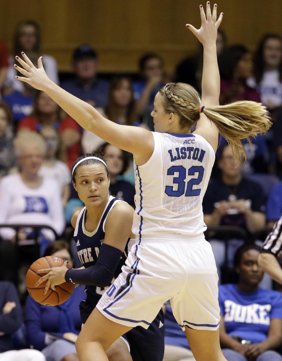 Notre Dame's Kayla McBride is guarded by Duke's Tricia Liston (32) during the first half of an NCAA college basketball game in Durham, N.C., Sunday, Feb. 2, 2014. (AP Photo/Gerry Broome)