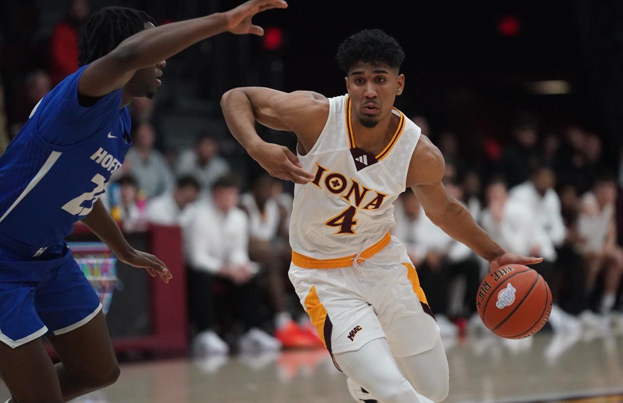 Iona guard Jean Aranguren (4) works against Hofstra guard Tyler Thomas (23) during NCAA mens basketball action at Iona University in New Rochelle on Wednesday, Dec 6, 2023.