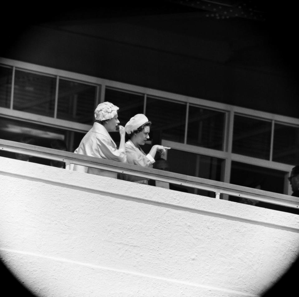<p>Queen Elizabeth II and Princess Margaret watch a race at the Derby Day at Epsom in 1959. The pair cheered on the Queen's colt, Above Suspicion, but Parthia — owned by Sir Humphrey de Trafford — took home the win. </p>