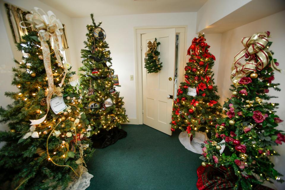 A quartet of decorated Christmas trees at the Sheboygan County Historical Research Center’s Treemendous Celebration holiday display as seen, Wednesday, November 30, 2022, in Sheboygan Falls, Wis.