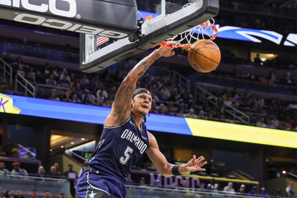 March 21: Orlando Magic forward Paolo Banchero dunks during the second quarter against the New Orleans Pelicans.