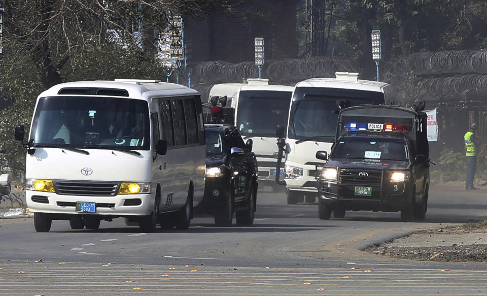 Police commandos escort vehicles carrying the Bangladesh cricket team as they arrive at the Gaddafi stadium for the second T20 cricket match against Pakistan, in Lahore, Pakistan, Saturday, Jan. 25, 2020. (AP Photo/K.M. Chaudary)