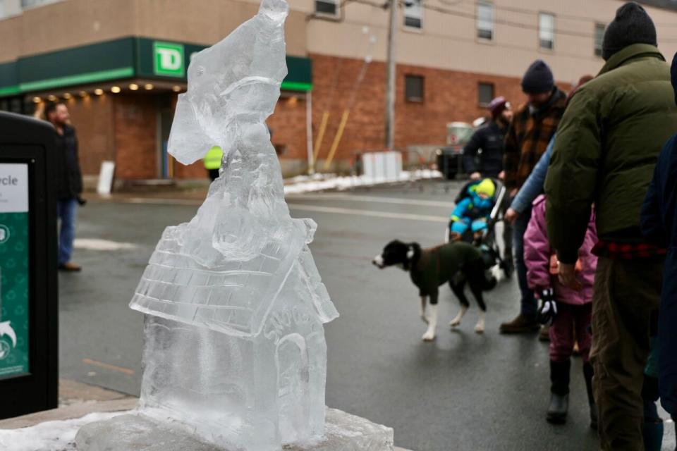 A depiction of Snoopy on his dog house was one of many ice sculptures lining Portland Street.