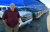 Carey ÒCWÓ Williams, general manager of James Wood MotorsÕ General Motors Company (GMC) shows off new high-end GMC Denali pickup trucks out on his lot in Decatur, Texas, U.S., February 4, 2019. REUTERS/Nick Carey