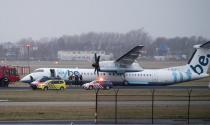 A plane of FlyBe airlines is seen of the runway of Schiphol airpoprt after landing gear broke in high winds, in Amsterdam