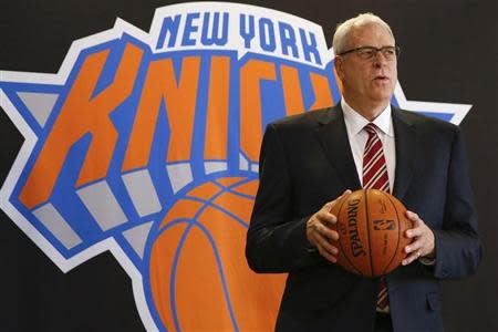 Phil Jackson poses during a news conference announcing him as the team president of the New York Knicks basketball team at Madison Square Gardens in New York March 18, 2014.REUTERS/Shannon Stapleton