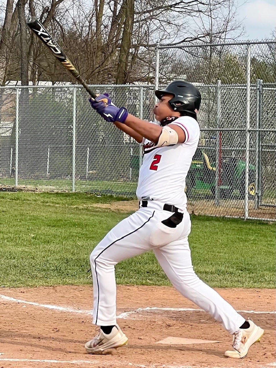 Marion Harding's Ray J Scott-Harbolt hits the ball during a home baseball game with River Valley this season. He is among the area leaders in batting average, home runs and RBIs.