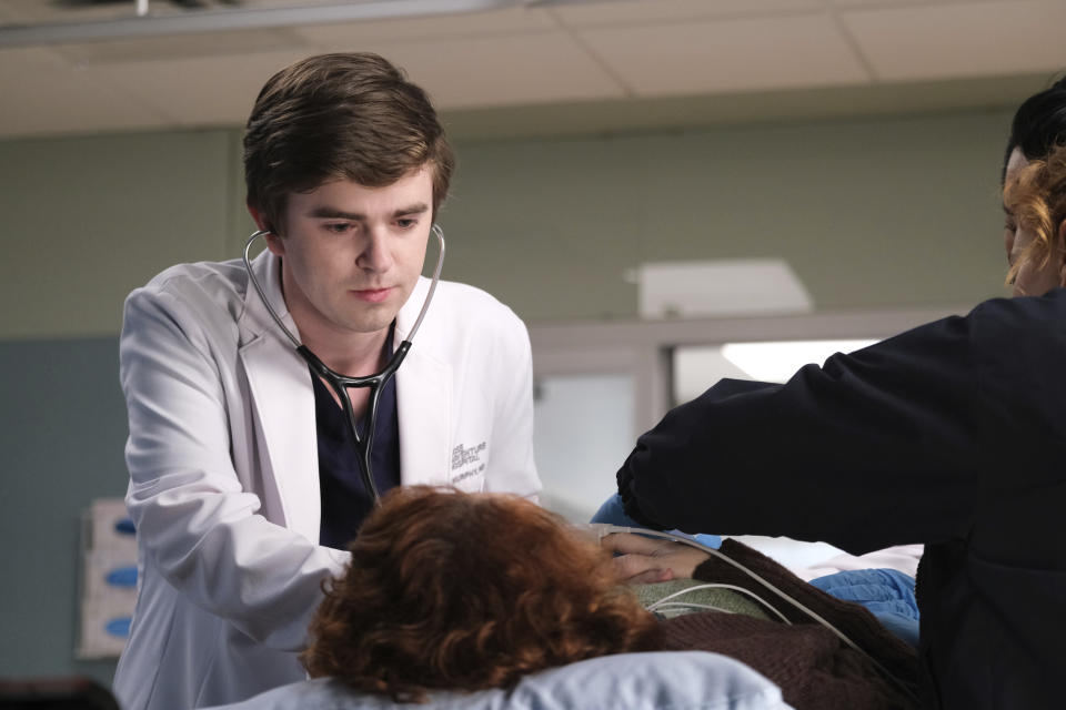 This image released by ABC shows Freddie Highmore in a scene from "The Good Doctor." They may only play doctors on TV, but they're giving real-life help to hospitals that have taken a hit from the coronavirus outbreak. The Fox medical series “The Resident” has donated some of its on-set masks and gowns to a hospital in Atlanta, where it shoots, and the ABC show “The Good Doctor” is moving to do the same in its home base of Vancouver, Canada. (Liane Hentscher/ABC via AP)