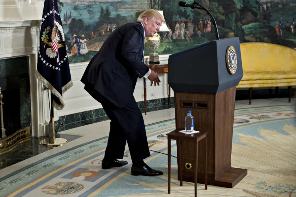 He couldn't find water underneath the podium. Photo: Getty Images