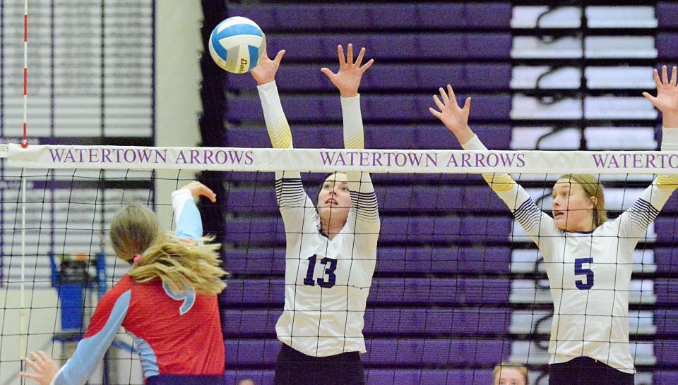 Watertown's Carter Jurrens and Emery Thury attempt to block Sioux Falls Lincoln's Linnea Nesheim during their high school volleyball match on Tuesday, Oct. 11, 2022 in the Civic Arena. Lincoln won 3-1.