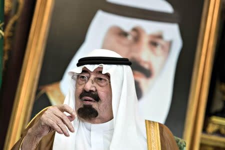 Saudi King Abdullah bin Abdul Aziz al-Saud sits before a meeting with U.S. Secretary of State John Kerry at the Royal Palace in Jeddah September 11, 2014. REUTERS/Brendan Smialowski/Pool