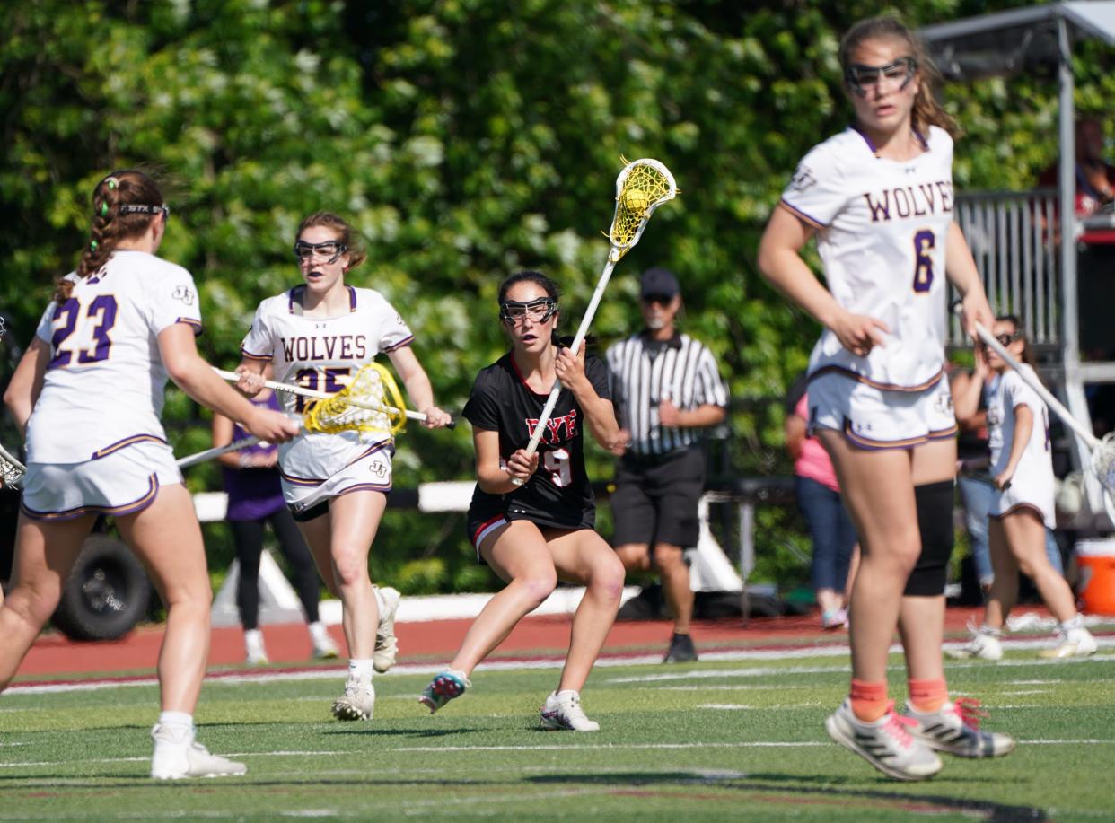 Rye's Della Goodman (9) controls the ball during the girls lacrosse Section 1 Class C championship game against John Jay-Cross River at Nyack High School in Nyack on Friday, May 26, 2023.