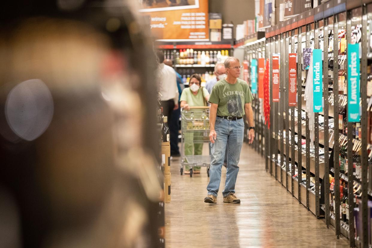 Shoppers explore the aisles of Total Wine as they check out the selection beer, spirits, wine and more during the business’ grand opening of the Tallahassee location Thursday, Oct. 6, 2022.