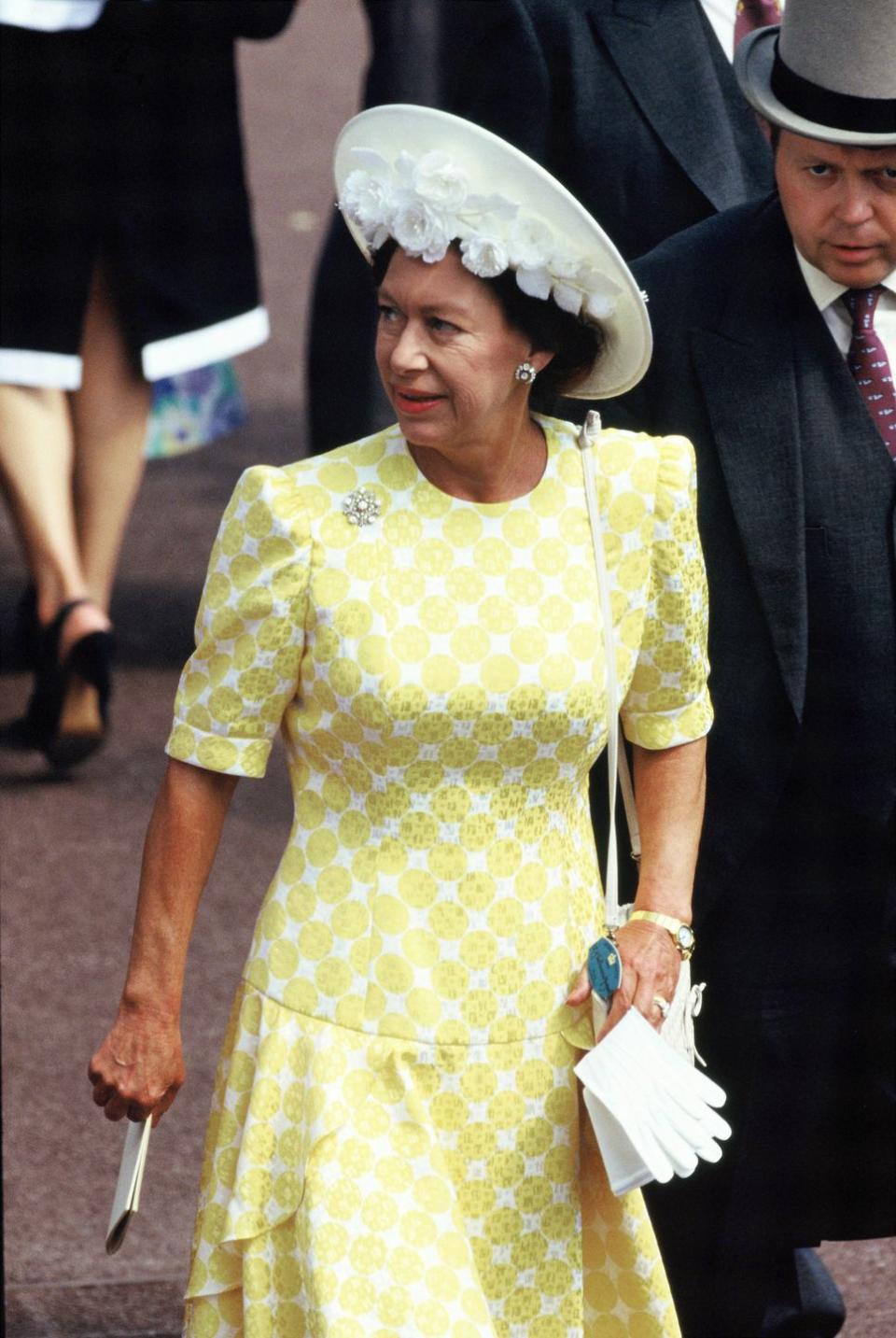 <p>The princess wears a white and yellow dress to Royal Ascot on June 21, 1989.</p>