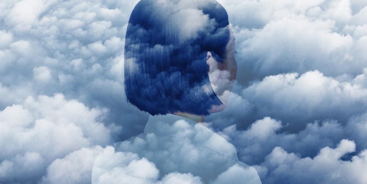 double exposure of woman looking off into sky and clouds