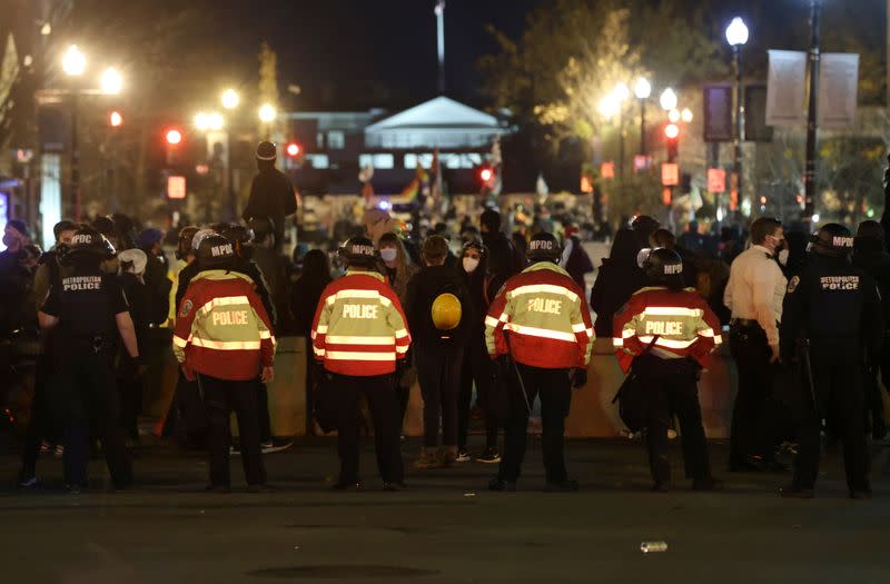 People take part in a rally to protest the results of the election, in Washington