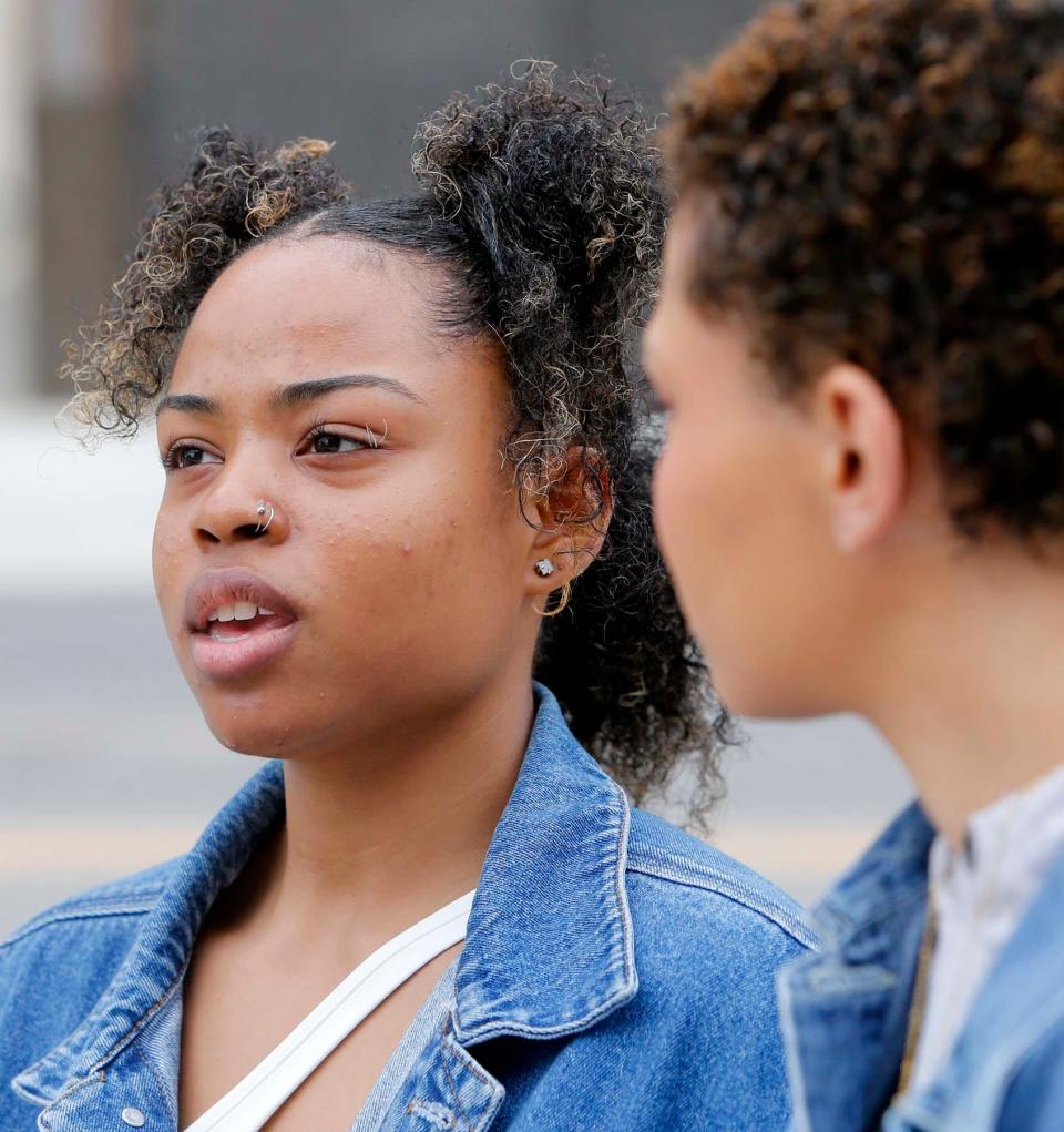 Shanice Mercer, 20, left, and Savannah Porter, 21, participate in the "Bans Off Our Bodies Rally -- Abortion Rights are Human Rights" rally Tuesday in front of the Federal Building in downtown Akron.