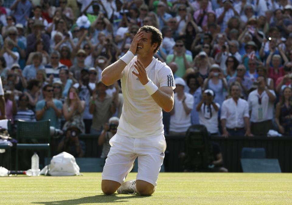 FILE - In this July 7, 2013, file photo, Andy Murray of Britain reacts after winning against Novak Djokovic of Serbia in the men's singles final match at the All England Lawn Tennis Championships in Wimbledon, London. (AP Photo/Kirsty Wigglesworth, File)