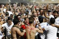 England fans in London celebrate as Harry Maguire scores against Sweden