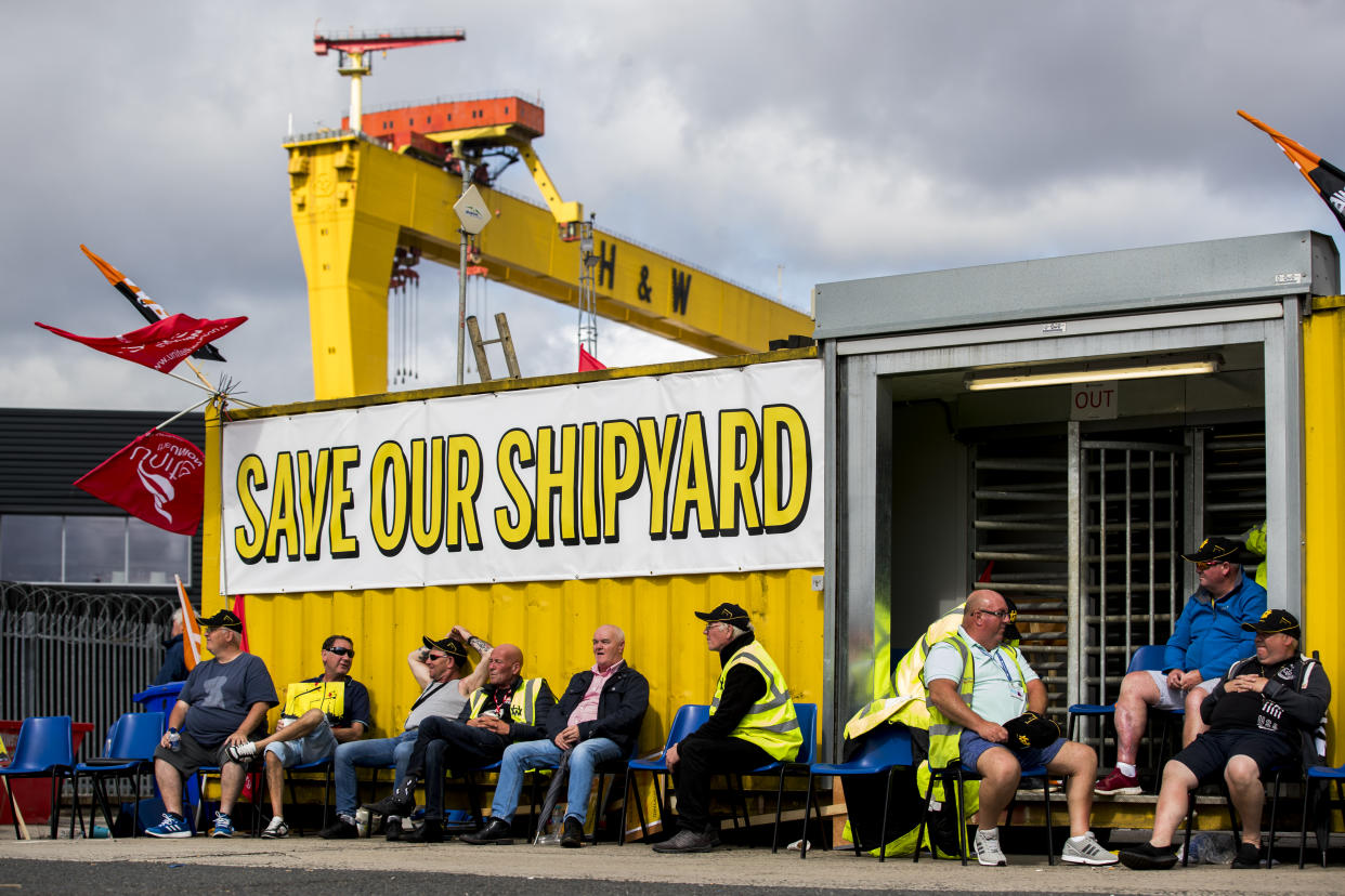 Employees of Harland and Wolff during their protest at the gates of the shipyard in Belfast, waiting to hear if there will be a last minute deal to keep the business from closing, as it is set to go into administration later.