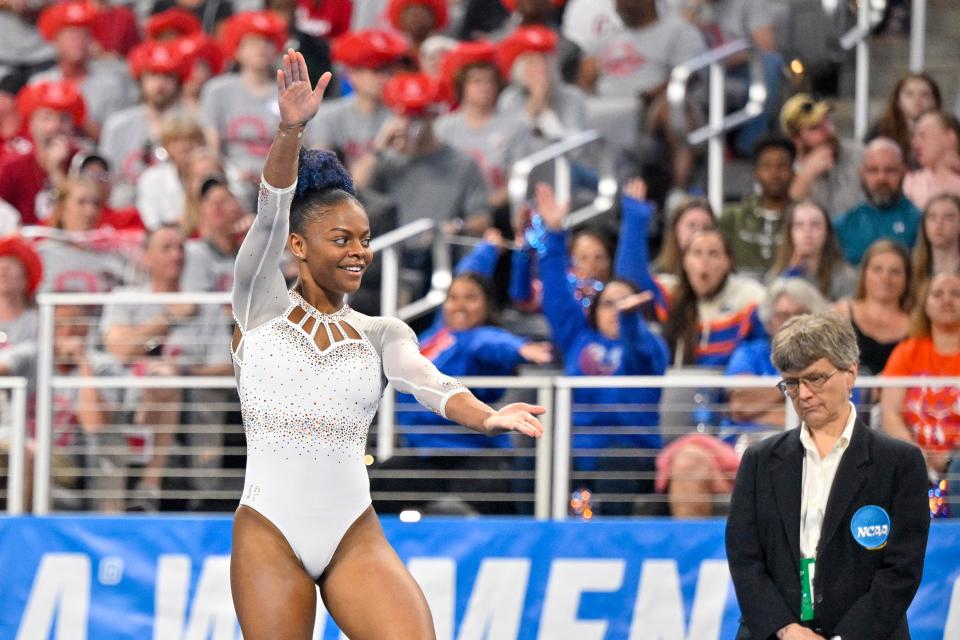 Apr 16, 2022; Fort Worth, TX, USA; University of Florida gymnast Trinity Thomas scores a perfect ten in floor exercise during the finals of the 2022 NCAA women's gymnastics championship at Dickies Arena. Mandatory Credit: Jerome Miron-USA TODAY Sports