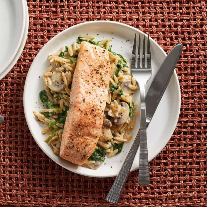 <p>In this quick salmon dinner, salmon fillets are paired with creamy orzo, wilted spinach and earthy mushrooms. Cooking the salmon at a high temperature helps speed up the cooking in this healthy dinner recipe. Look for pre-sliced mushrooms to speed it up even more. <a href="https://www.eatingwell.com/recipe/7883720/salmon-creamy-orzo-with-spinach-mushrooms/" rel="nofollow noopener" target="_blank" data-ylk="slk:View Recipe" class="link ">View Recipe</a></p>