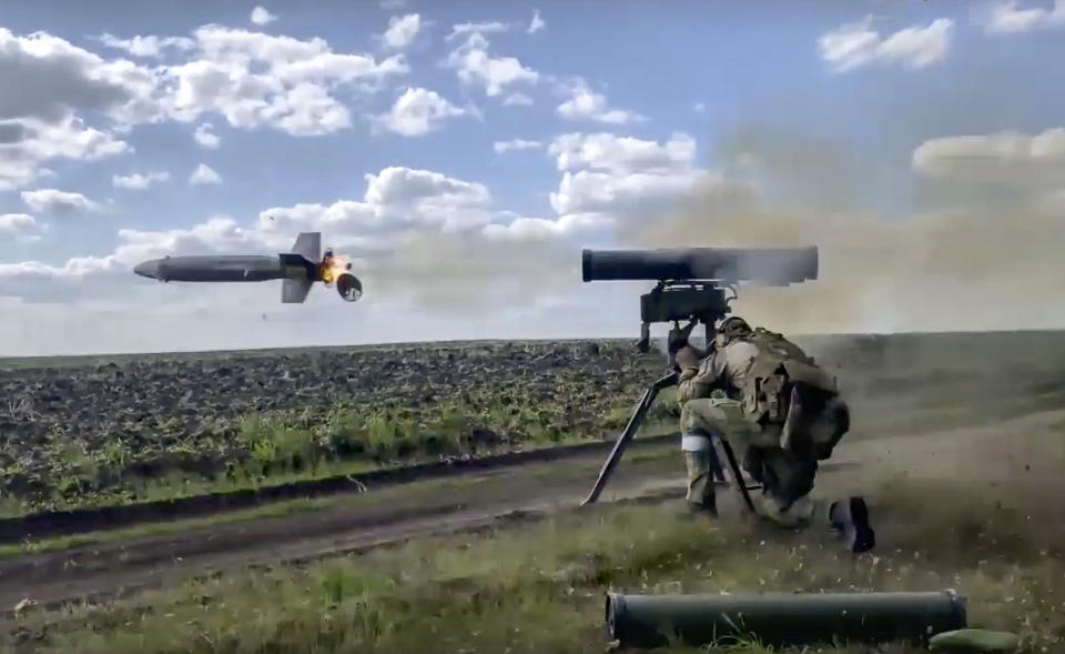 FILE - In this handout photo taken from video released by Russian Defense Ministry Press Service on Monday, Aug. 29, 2022, a Russian soldier fires from a Kornet, a Russian man-portable anti-tank guided missile on a mission at an undisclosed location in Ukraine. (Russian Defense Ministry Press Service via AP, File)