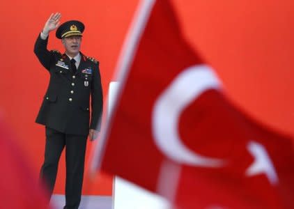 Turkey's Chief of the General Staff Hulusi Akar greets audience during the Democracy and Martyrs Rally in Istanbul, Turkey, August 7, 2016.  REUTERS/Osman Orsal