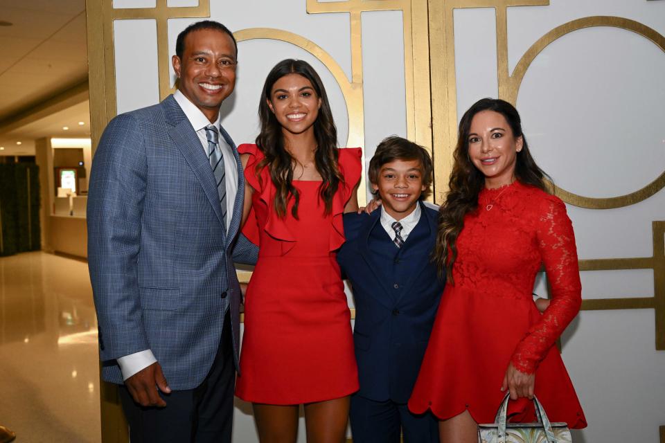 Woods poses with his daughter, Sam, son, Charlie, and girlfriend Erica Herman after the World Golf Hall of Fame Induction Ceremony. (Chris Condon / PGA Tour via Getty Images)