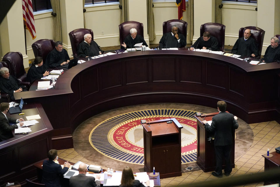 Mississippi Supreme Court Chief Justice Michael Randolph, center, questions attorney Justin Matheny of the Mississippi attorney generalâ€™s office, during arguments over a lawsuit that challenges the state's initiative process and seeks to overturn a medical marijuana initiative that voters approved in November, Wednesday, April 14, 2021 in Jackson, Miss. (Rogelio V. Solis/AP)