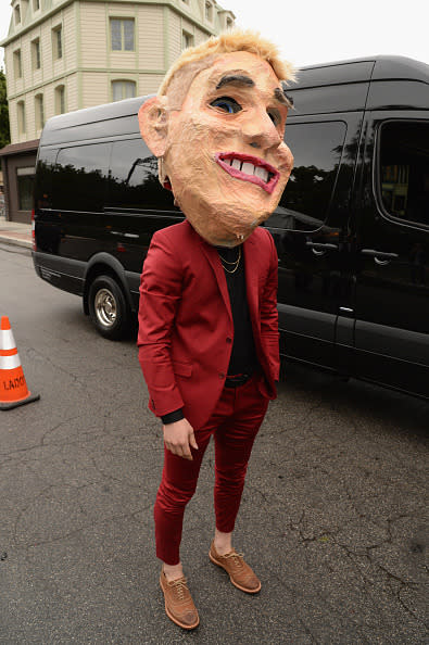 Singer Mike Posner pulling a Sia in a massive mask 