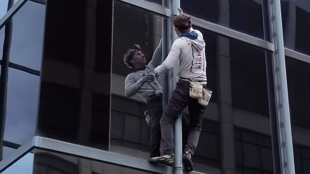 Maison DesChamps climbs a building.