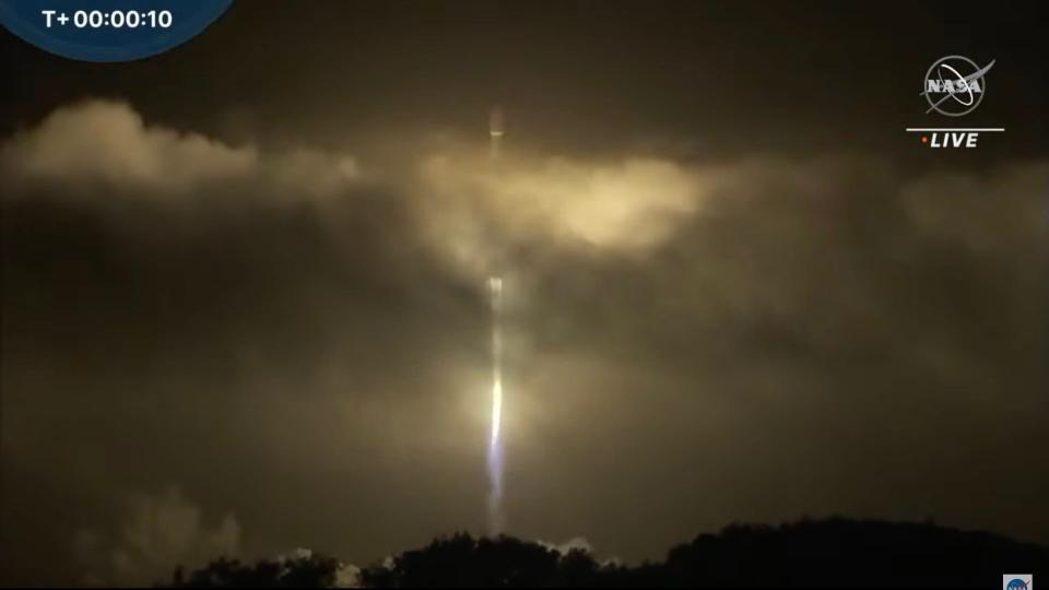 falcon 9 rocket lifting off at night with dart mission