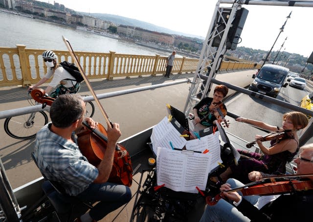 An orchestra plays on a truck