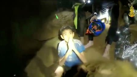 Boys from the under-16 soccer team trapped inside Tham Luang cave greet members of the Thai rescue team in Chiang Rai, Thailand. Thai Navy Seal/via REUTERS TV