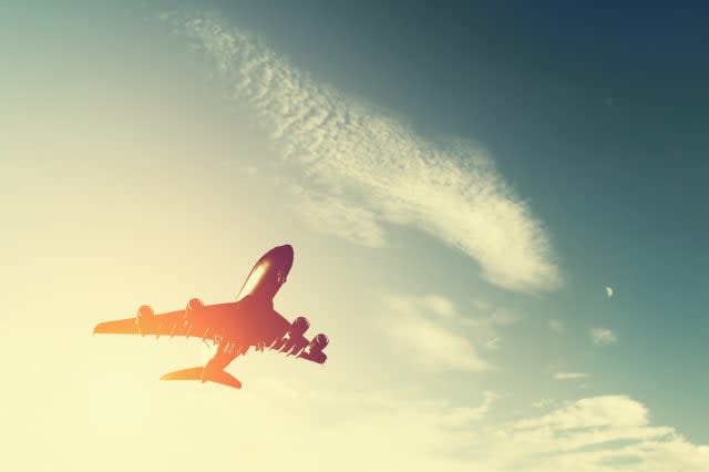 airplane taking off at sunset....