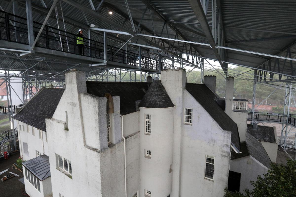 Emma Cooper walking along the walkways that form part of National Trust for Scotland Box which covers Charles Rennie Mackintosh Hill House in Helensburgh <i>(Image: Andrew Milligan)</i>